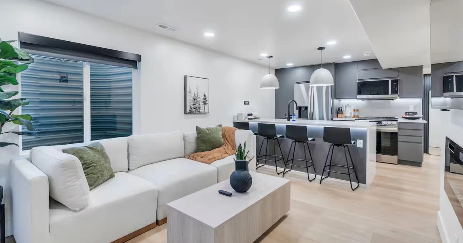 A guest opening the private entrance to a luxury rental in Lehi.